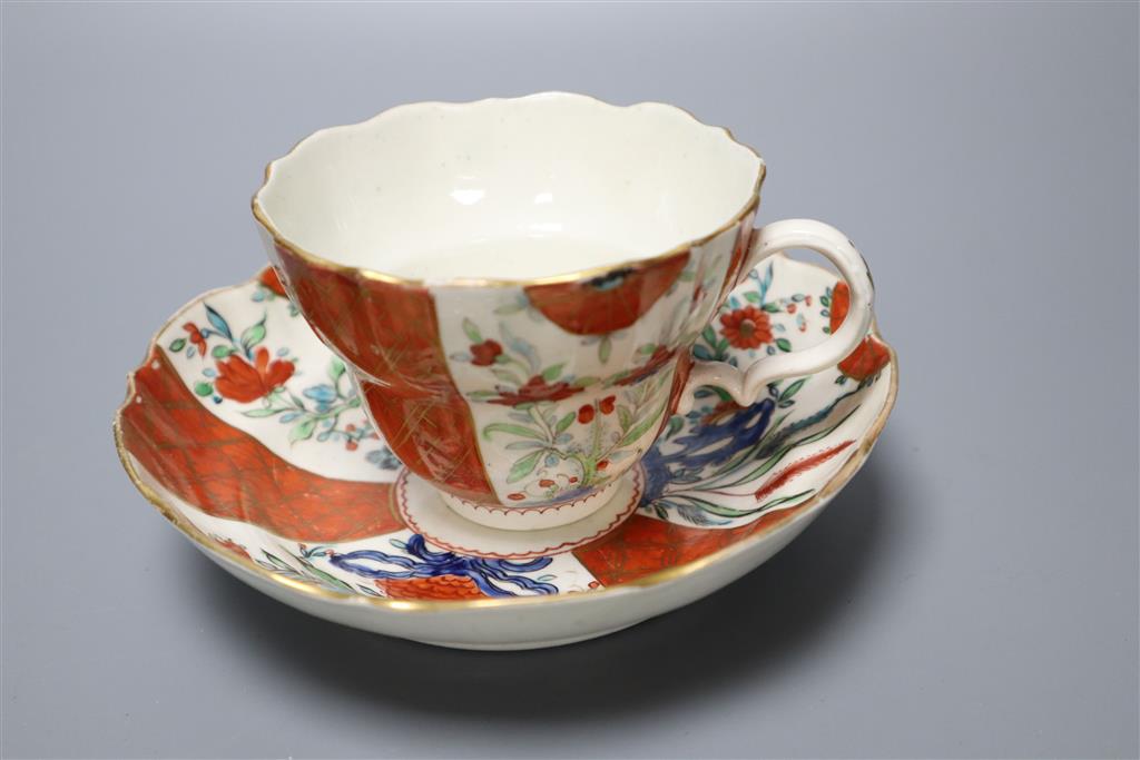 A Worcester cup and saucer, late 18th century, and a pair of Meissen outside printed coffee cups and saucers, largest saucer diameter 1